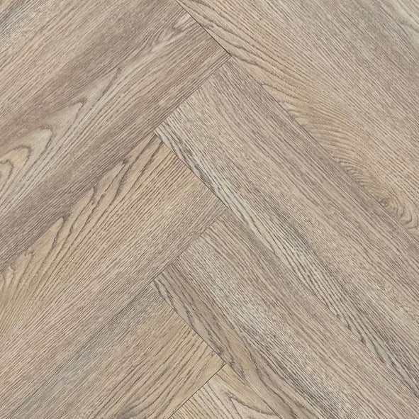 Wooden flooring tiles arranged in a herringbone pattern on a dark background