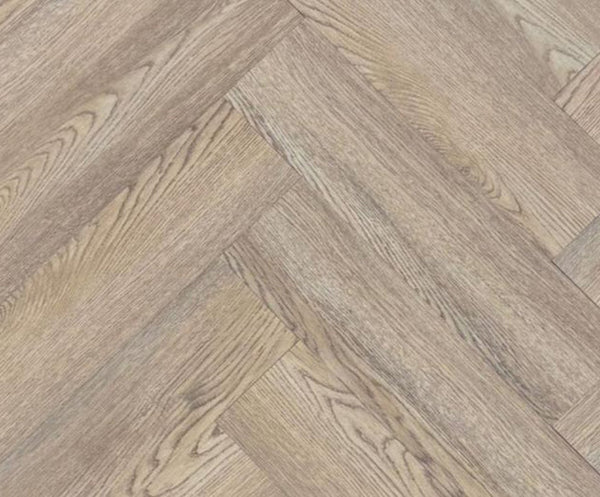Close-up texture detail of light brown herringbone luxury vinyl tiles