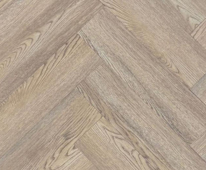 Close-up texture detail of light brown herringbone luxury vinyl tiles