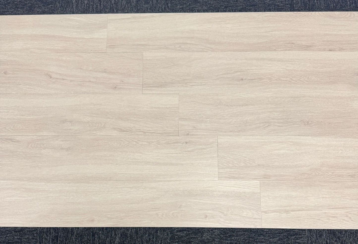 Scandinavian pine LVT installation process with adhesive application