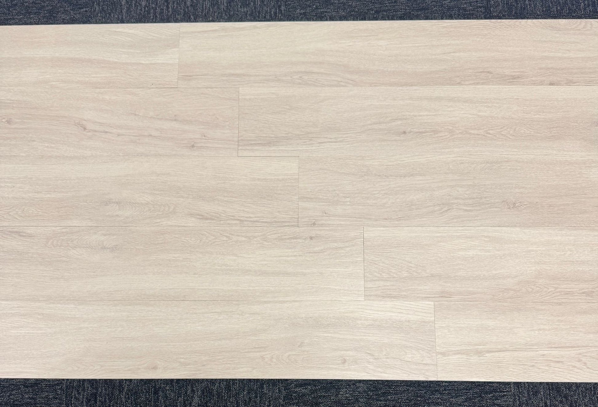 Scandinavian pine LVT installation process with adhesive application