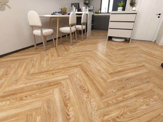 Wooden floor with a herringbone pattern in a room with furniture.