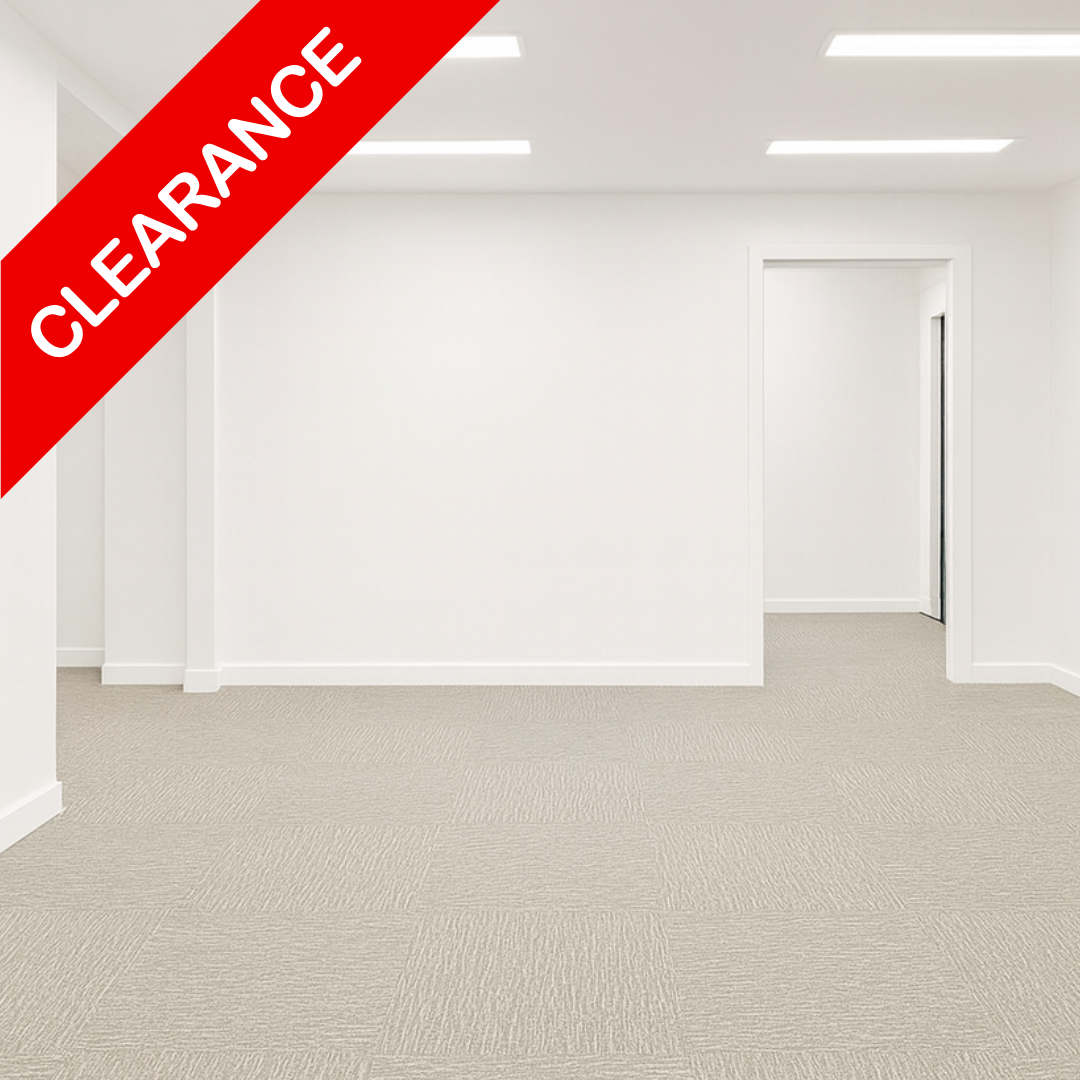 Light grey textured carpet tiles installed in a bright, empty office room with white walls and ceiling lights, featuring a red diagonal 'CLEARANCE' banner overlay.