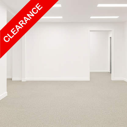 Light grey textured carpet tiles installed in a bright, empty office room with white walls and ceiling lights, featuring a red diagonal 'CLEARANCE' banner overlay.