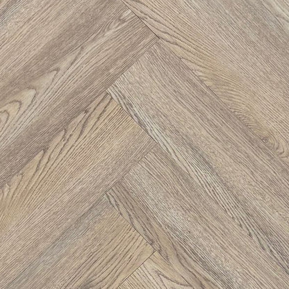 Wooden flooring tiles arranged in a herringbone pattern on a dark background