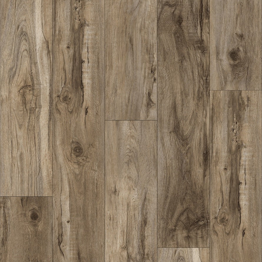 Wood-look plank flooring sample with a weathered taupe-brown grain pattern and a small QAK logo and model text along the bottom edge.
